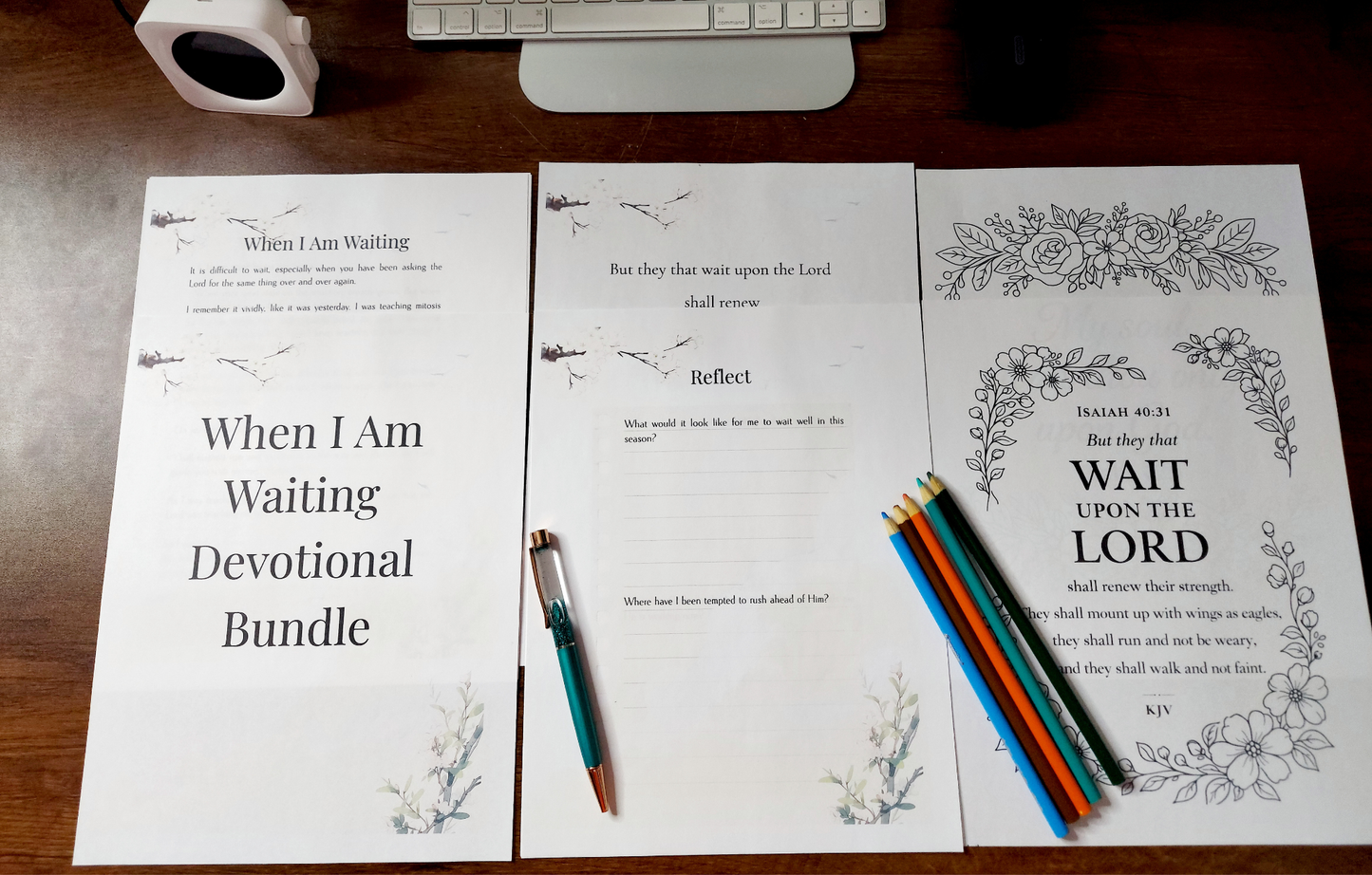 Devotional bundle with printed pages and pens on a wooden surface