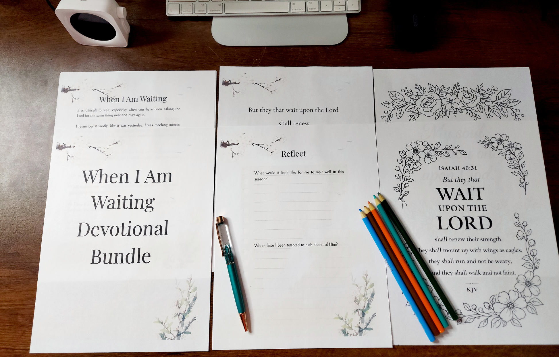Devotional bundle with printed pages and pens on a wooden surface